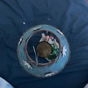 Santa and snowman candle burning